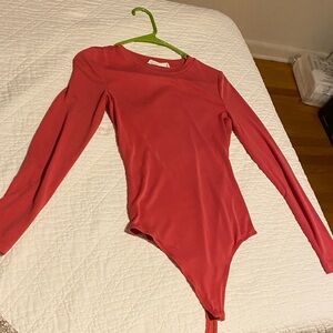 Elodie Long-Sleeve One-Piece Bodysuit in Coral
